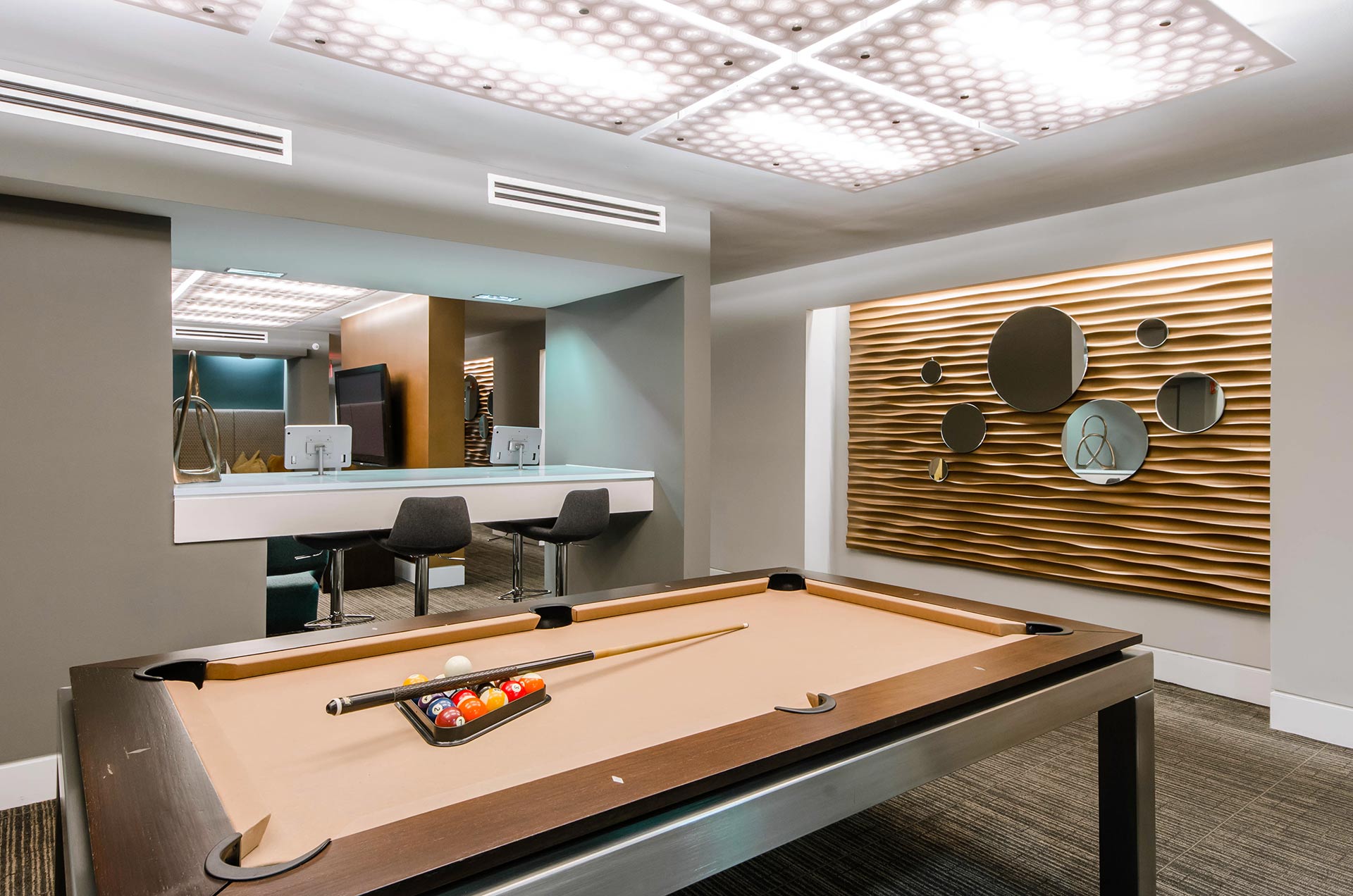 Clubroom nook with pool table and computer bar in the background