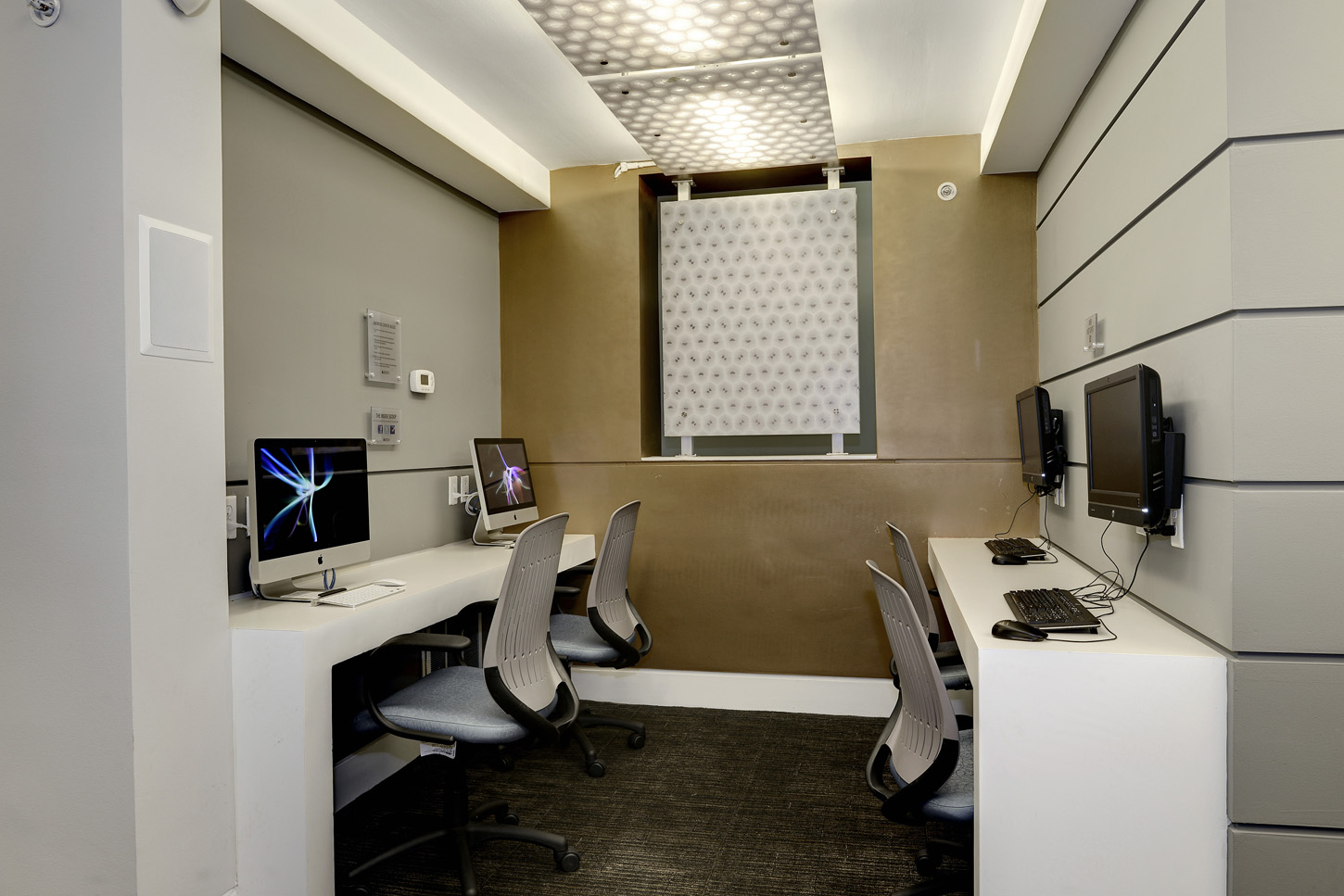 Clubroom nook with iMac and PC computer stations